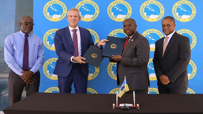 Images of representatives signing the MoU