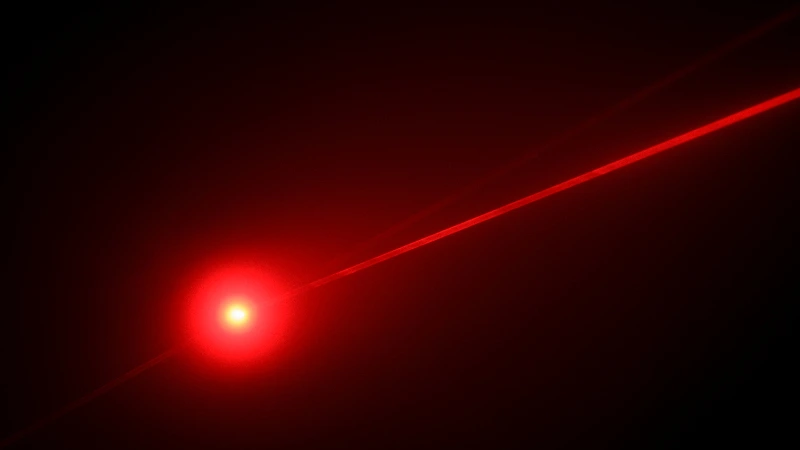 a red laser beam on a black background