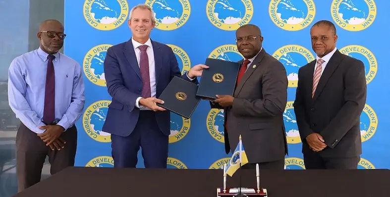 Images of representatives signing the MoU
