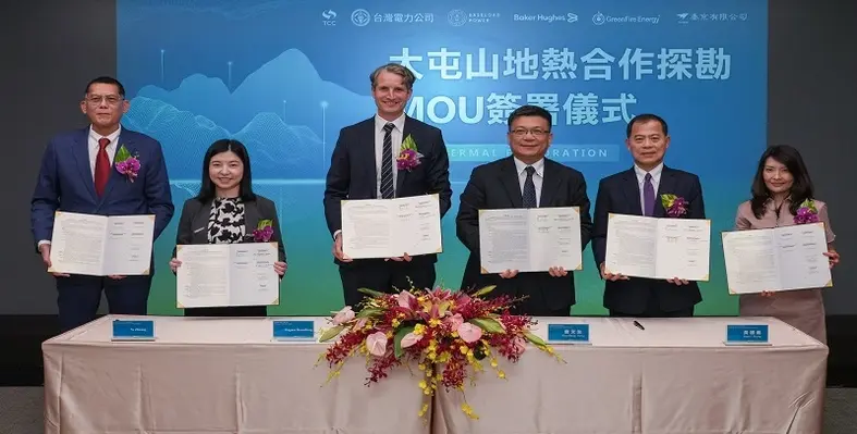 Key executives from the different partners posing for a picture with the signed MoU. 