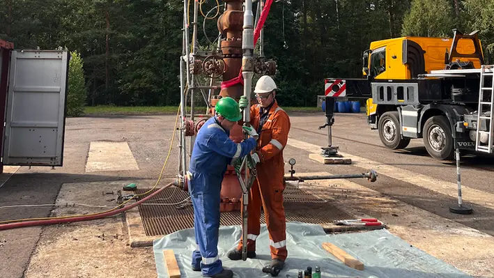 two_male_engineers_drilling_site